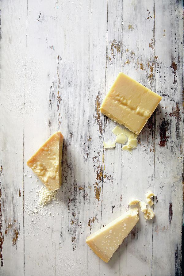 Pieces Of Parmesan Cheese Of Different Ripenesses Photograph by Jalag / Stefan Bleschke