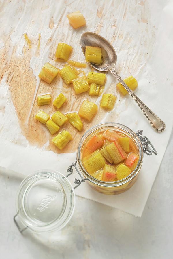 Pieces Of Rhubarb Cooked In Their Own Juice In A Flip-top Jar Photograph by Sandra Eckhardt