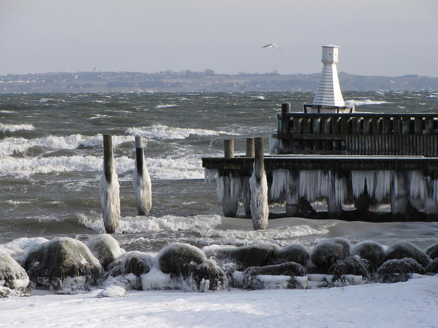 Pier Covered In Ice And Stormy Weather Photograph by Photo By Betty Nancy Olsen