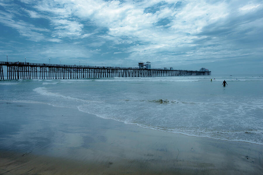 Pier Out of the Blue Photograph by Debra Kewley