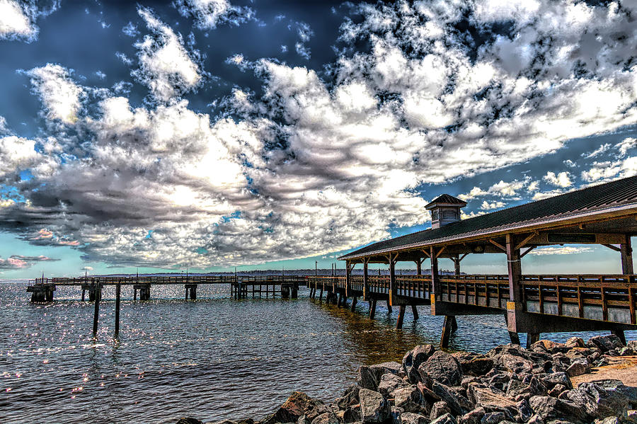 Pier Under Gathering Clouds Photograph by Darryl Brooks