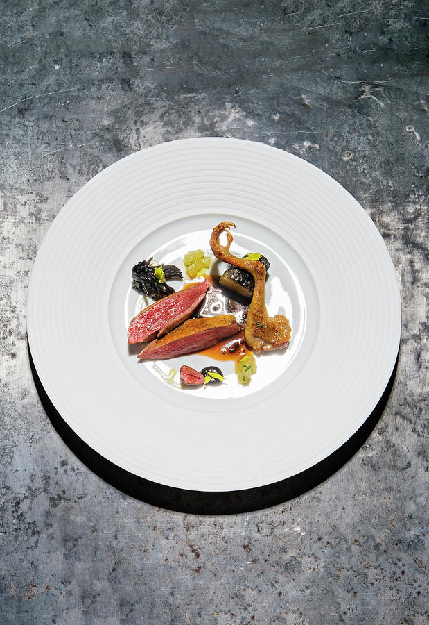 Pigeon With Variations Of Celery And Black Garlic Photograph by Tre Torri