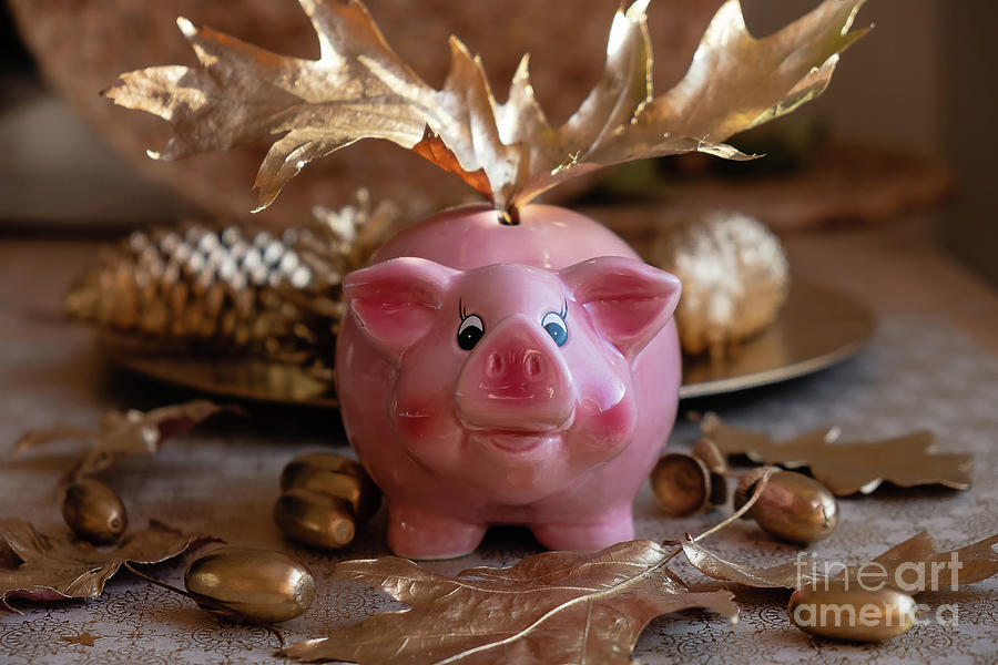 Piggy bank on the golden background Photograph by Marina Usmanskaya