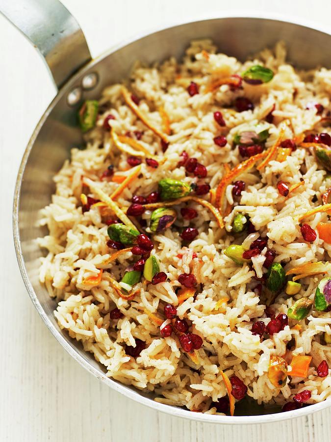 Pilau Rice With Pistachio Nuts, Pomegranate Seeds And Orange Zest Photograph by Geoff Fenney