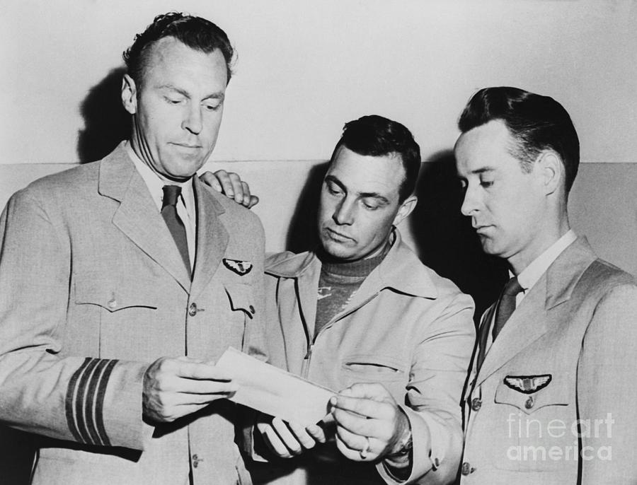 Pilots Looking At Photo Of Ufo Photograph by Bettmann