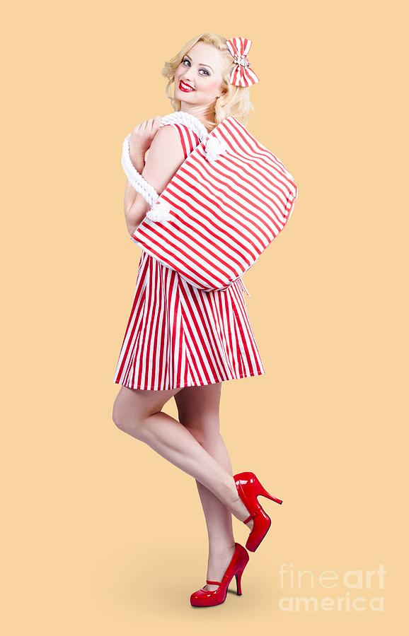 Pin up girl wearing stripped red dress holding bag Photograph by Jorgo Photography