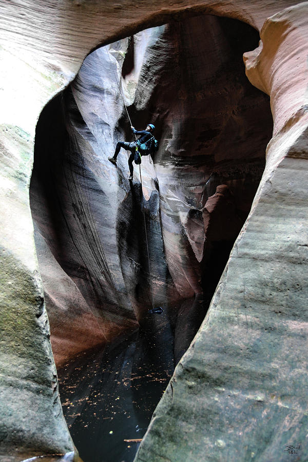 Pine Creek Canyoneer Rappelling Arch Photograph by Brett Pelletier