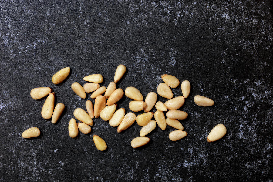 Pine Nuts On A Dark Background Photograph by Petr Gross