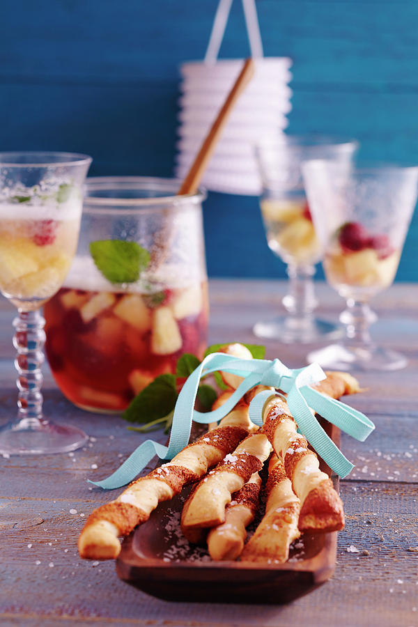 Pineapple And Raspberry Punch With Spicy Yeast Dough And Puff Pasty Parmesan Sticks Photograph by Teubner Foodfoto