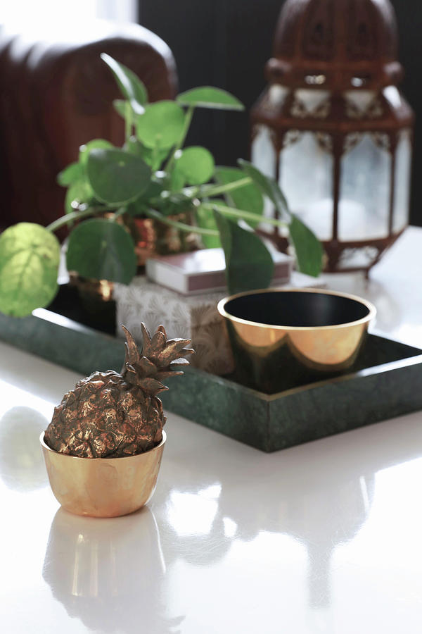 Pineapple Ornament In Golden Bowl In Front Of Chinese Money Plant On Tray Photograph by Annette Nordstrom