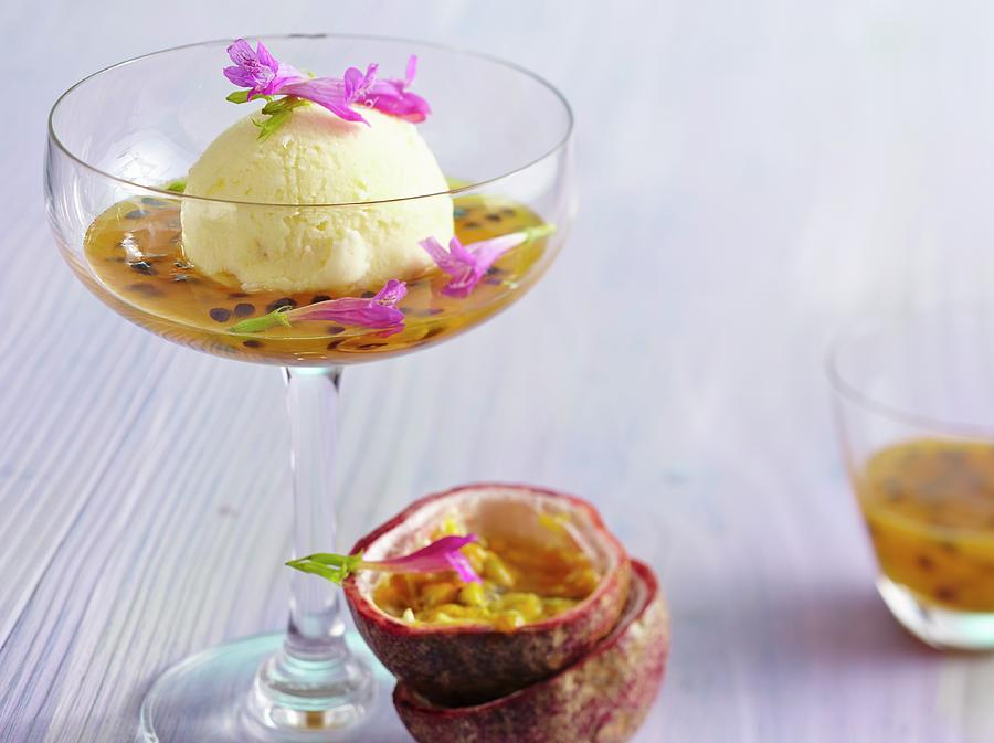 Pineapple Sorbet With Passion Fruit Sauce And Sage Flowers Photograph by Teubner Foodfoto