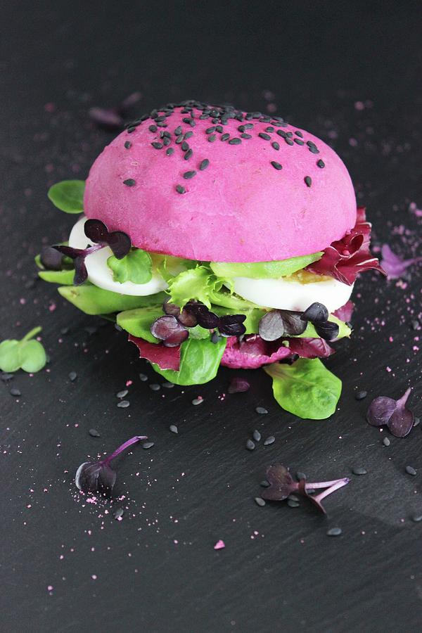 Pink Burger With Avocado And Egg Photograph by Esspirationen