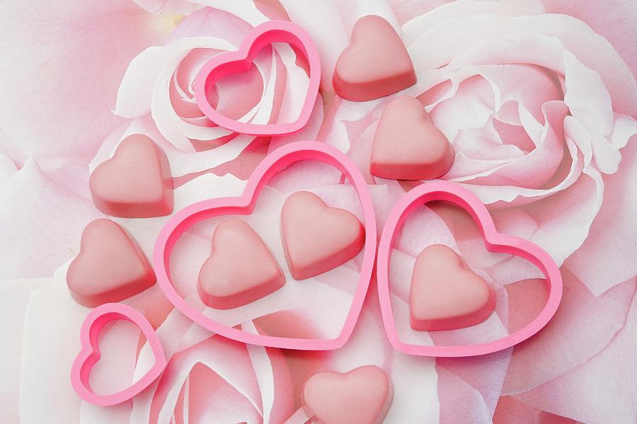 Pink Chocolate Love Hearts With Heart Shaped Cookie Cutters On A Pastel Rose Pattern Photograph by Burgess, Linda