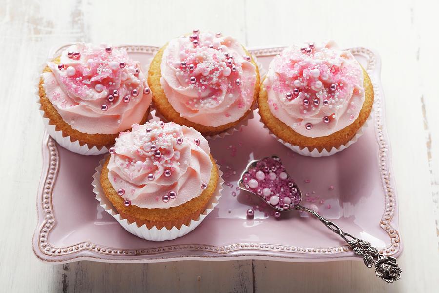 Pink Cupcakes With Sugar Pearls Photograph by Foodcollection
