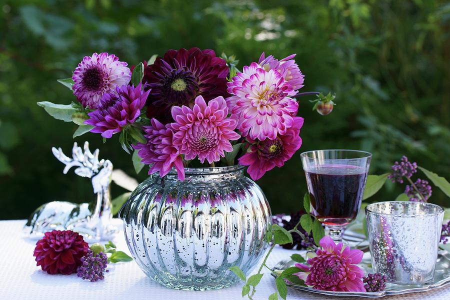 Pink Dahlias In Spherical, Silver Vase Next To Glass Of Red Wine On Silver Tray In Garden Photograph by Angelica Linnhoff