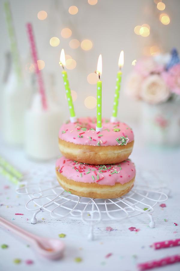 Pink Doughnuts With Birthday Candles Photograph by Dorota Ryniewicz