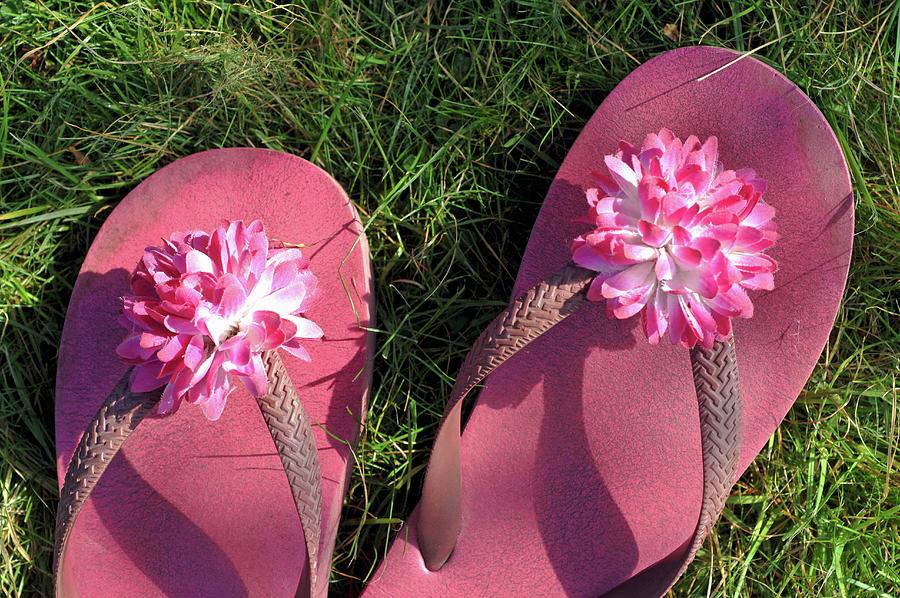 Pink Flip-flops With Artificial Flowers On Straps On Lawn Photograph by Twins