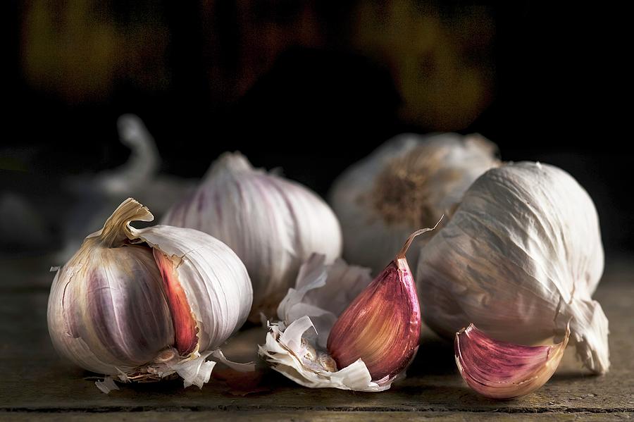 Pink Garlic On A Wooden Surface Photograph by Piga & Catalano S.n.c.