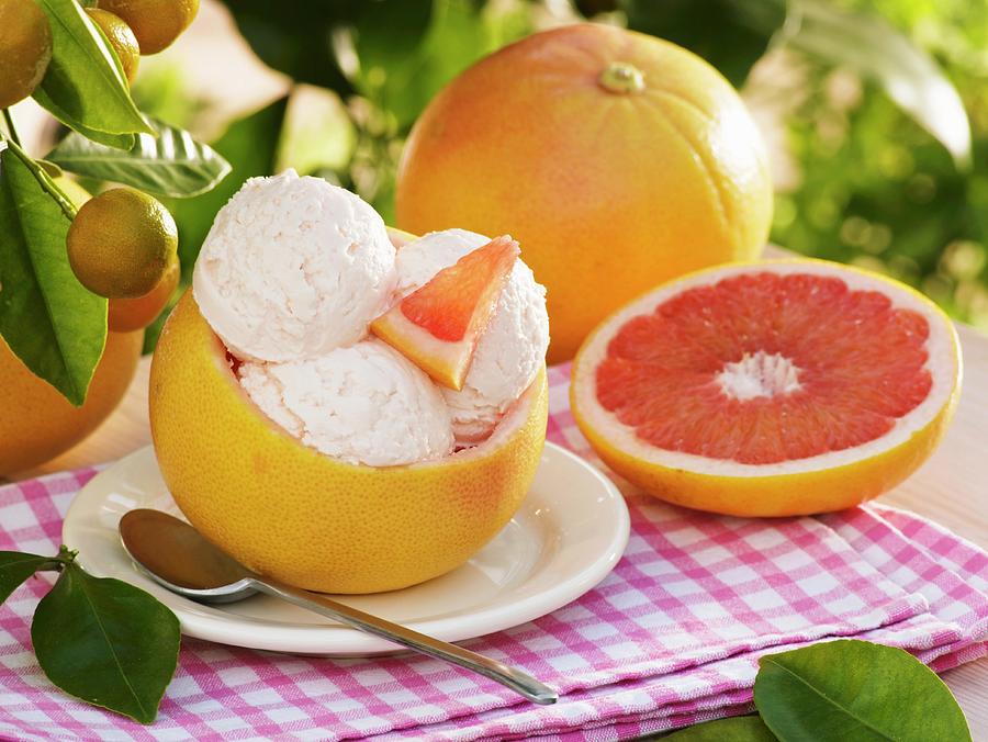 Pink Grapefruit Ice Cream In Hollowed-out Grapefruit Shell Photograph by Strauss, Friedrich
