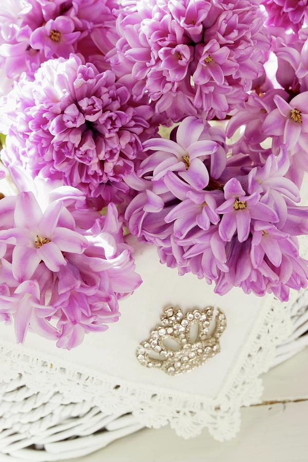 Pink Hyacinth Flowers, Lace Doily And Rhinestone Brooch Photograph by Angelica Linnhoff