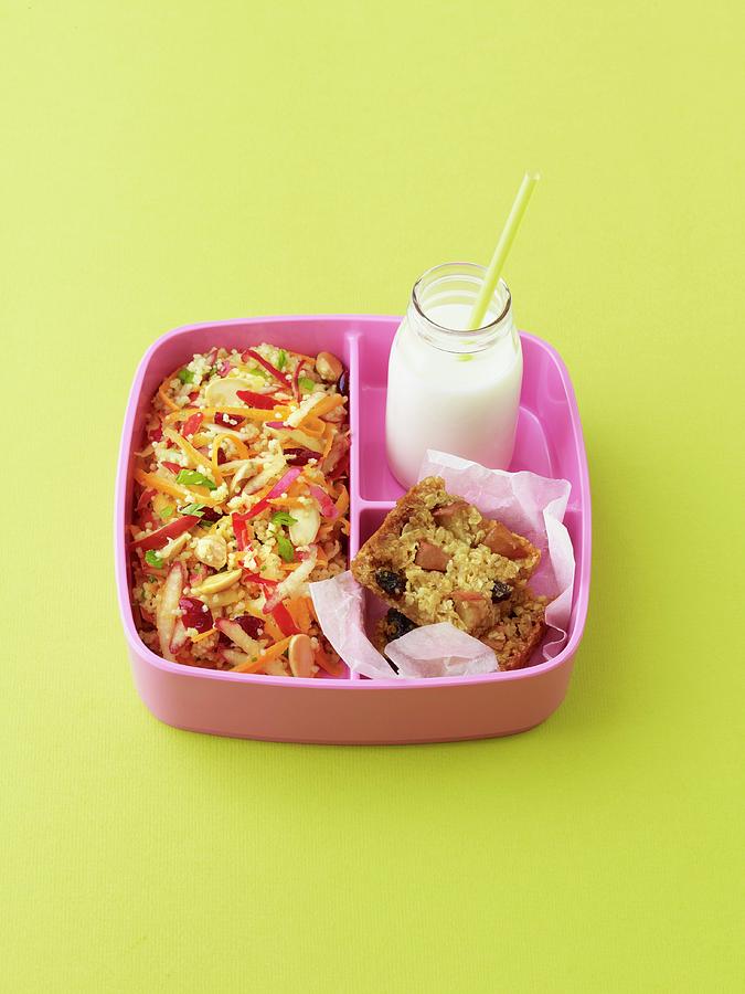 Pink Lady Apple And Couscous Salad, With Apple Flapjack, And Bottle Of Milk, In A Pink Bento Lunchbox Photograph by Will Shaddock Photography