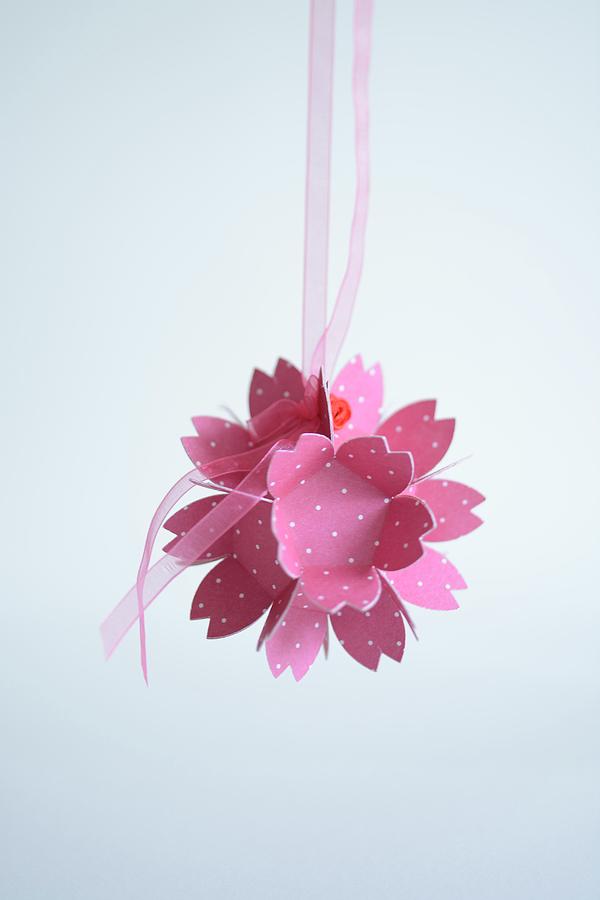 Pink Paper Flower Hung From Ribbon Photograph by Tanja Major