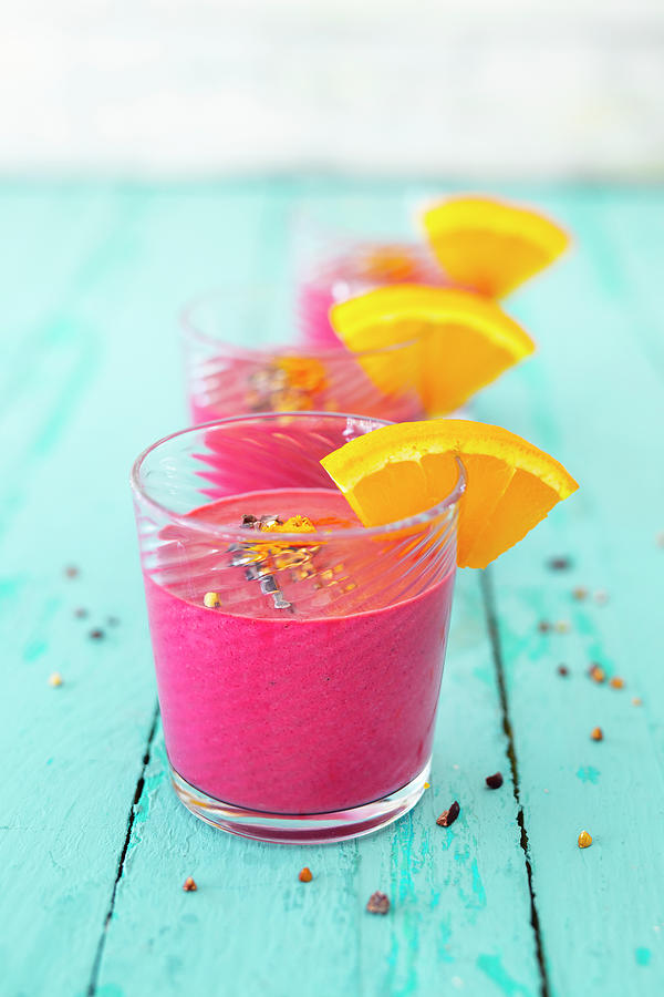 Pink Power Smoothies Made With Beetroot, Oranges, Apples And Bananas Photograph by Jan Wischnewski