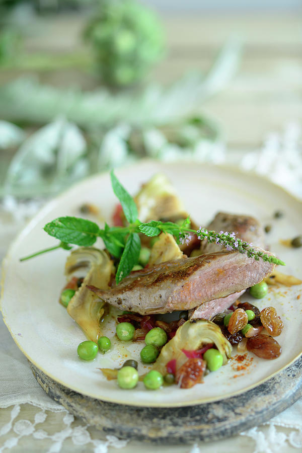 Pink Roasted Lamb Fillet With Artichoke And Pea Ragout turkey Photograph by Tanja Major