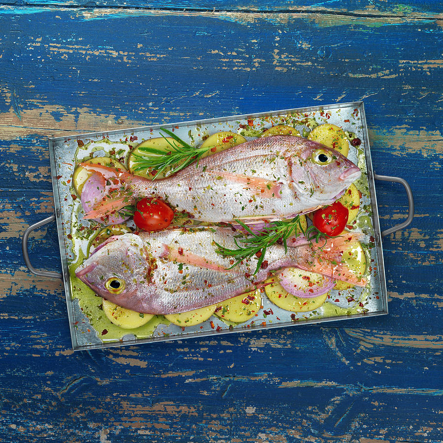 Pink Sea Bream With Potatoes And Herbs Photograph by Garcia