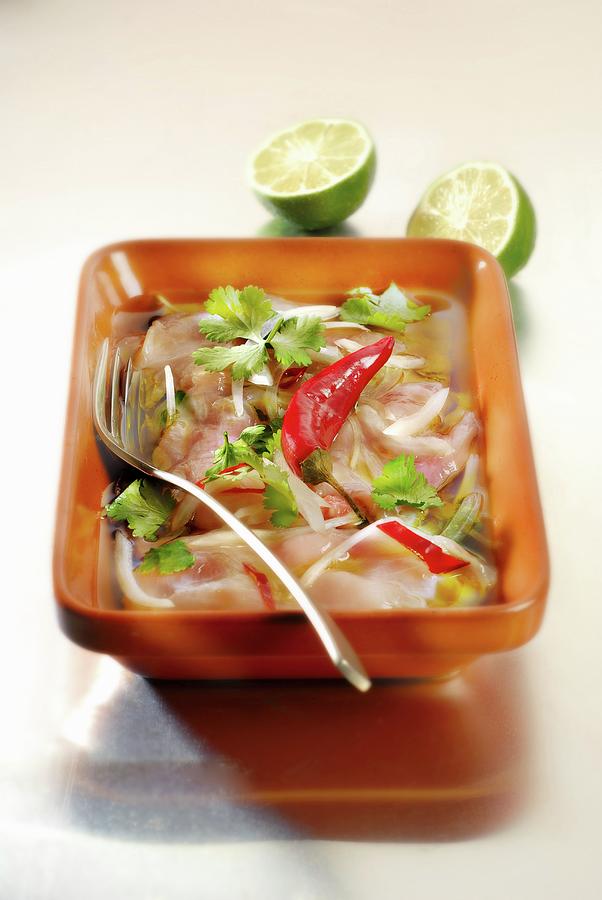 Pink Seabream Marinating With Onions, Chili Peppers, Lime And Coriander Photograph by Perrin