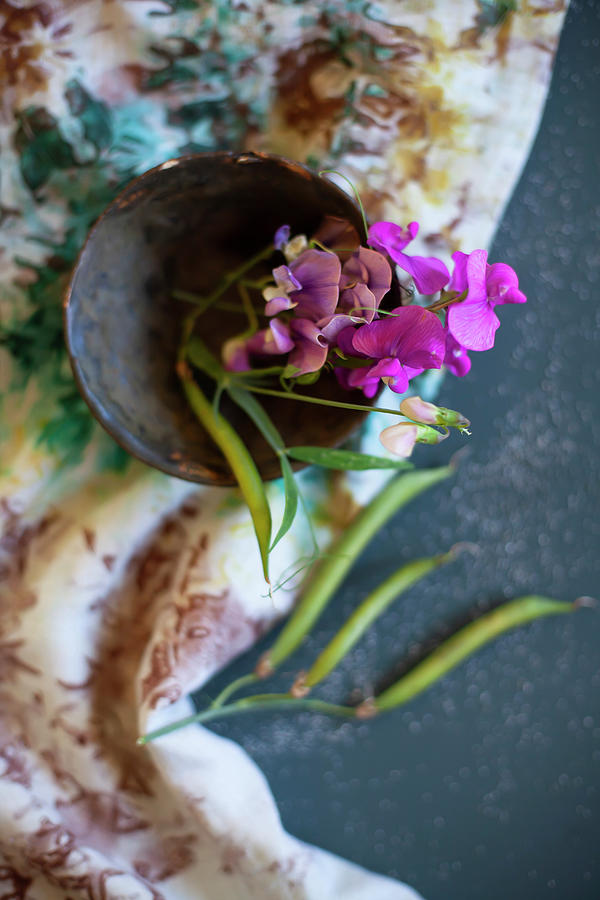 Pink Sweet Peas In Bowl On Floral Cloth Photograph by Alicja Koll