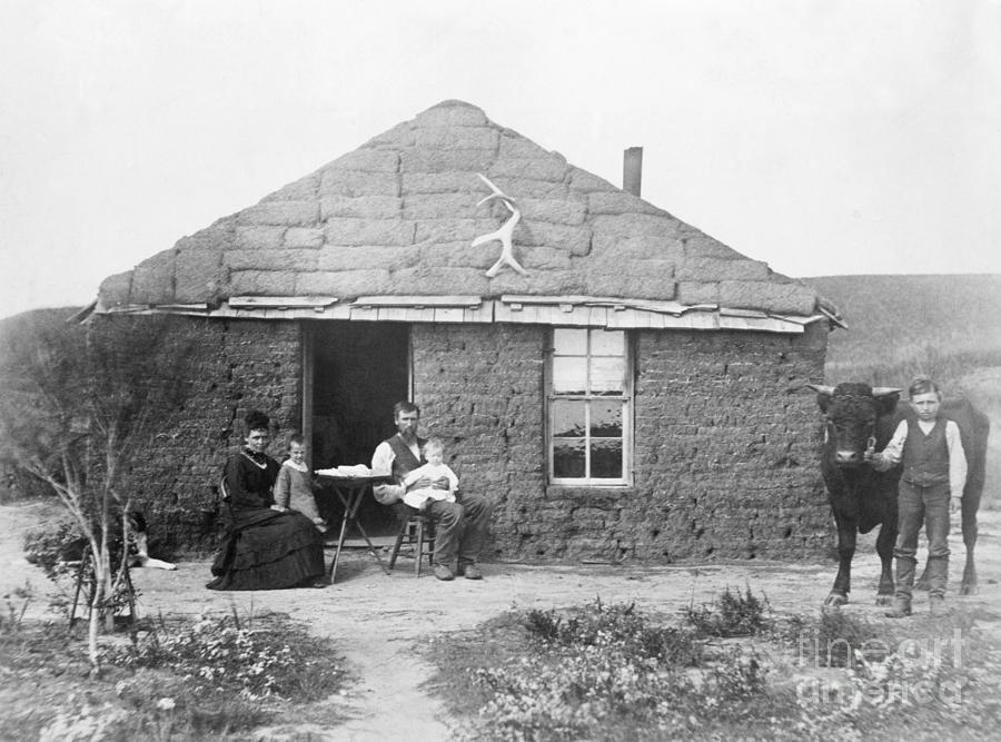Pioneer Family Outside Sod House Photograph by Bettmann