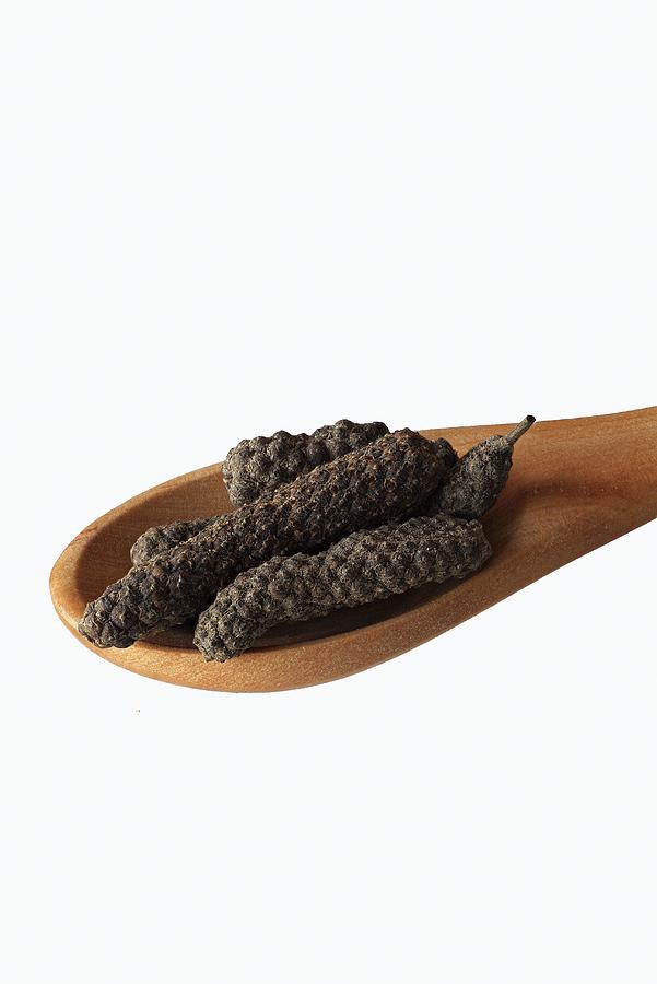 Pippali long Pepper On A Wooden Spoon Photograph by Dr. Martin Baumgrtner