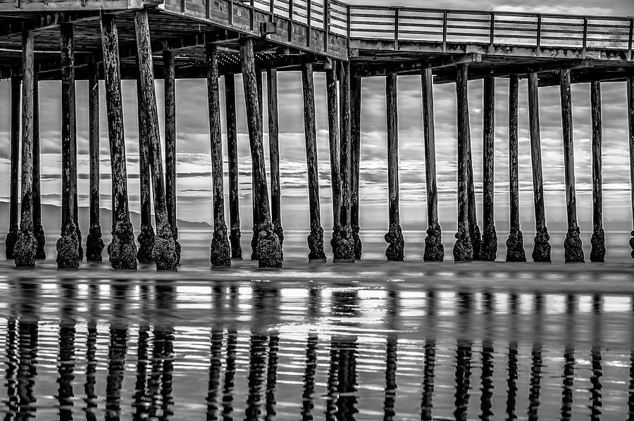 Pismo Beach Pier Ocean Reflections - Monochrome Photograph by Gregory Ballos