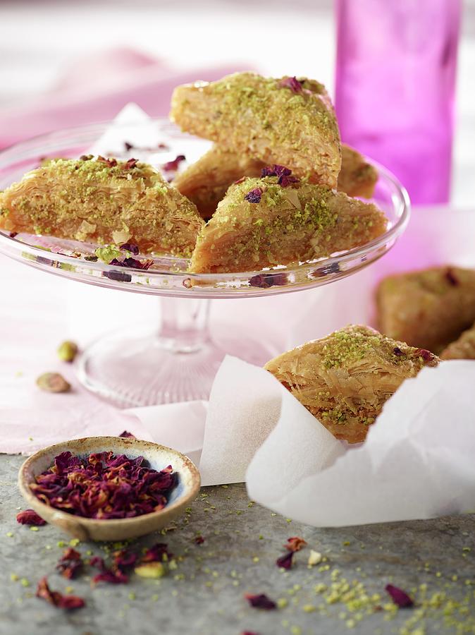 Pistachio Baklava With Rose Petals On Cake Stand With Pink Napkin Photograph by Artfeeder