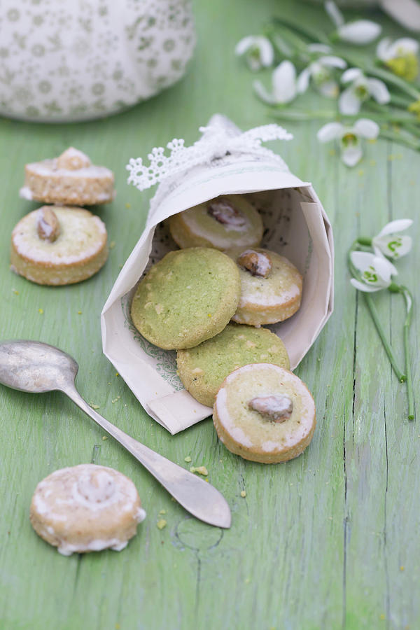 Pistachio Biscuits In Cone Handmade From Sheet Music With Lace Trim Photograph by Martina Schindler