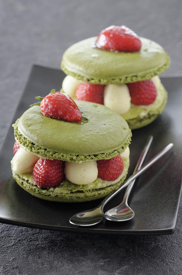 Pistachio Macarons Filled With Cream And Strawberries Photograph by Jean-christophe Riou