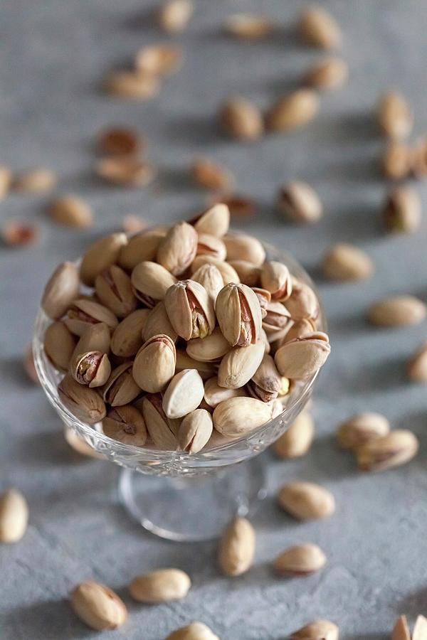 Pistachios In A Crystal Glass Bowl Photograph by Sonya Baby