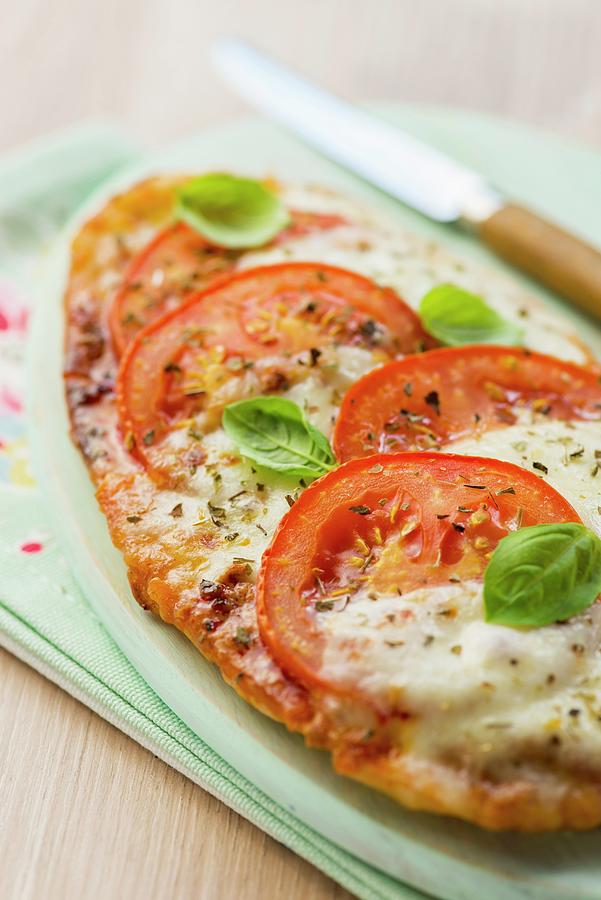 Pita Bread Pizza With Tomatoes, Mozzarella And Basil Photograph by Jonathan Short