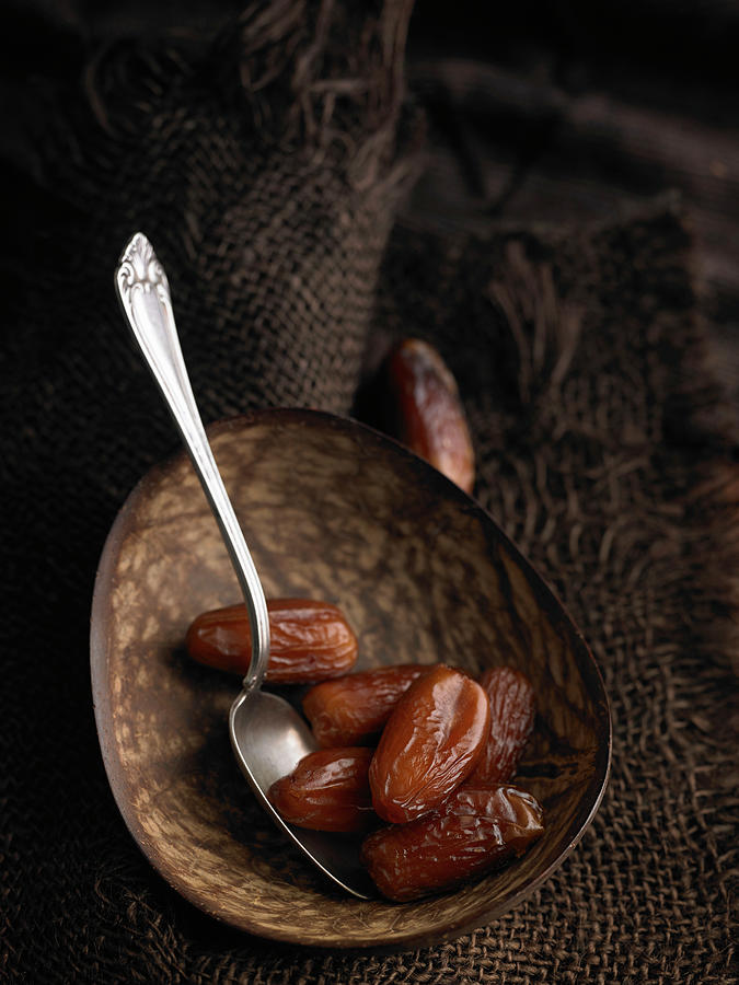 Pitted Dates With A Spoon In A Bowl Photograph by Nikolai Buroh