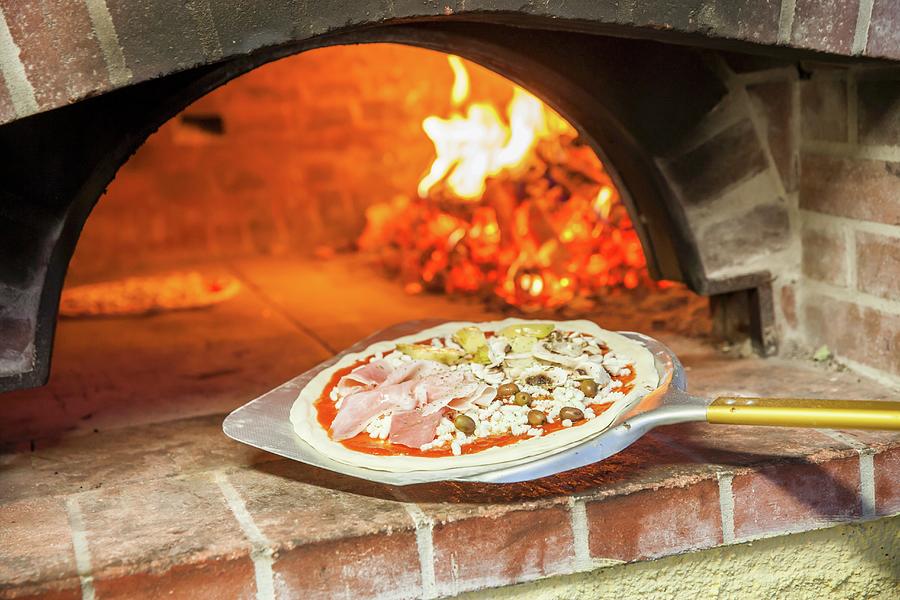 Pizza Capricciosa In Front Of A Wood Oven Photograph by Imagerie - Fine ...