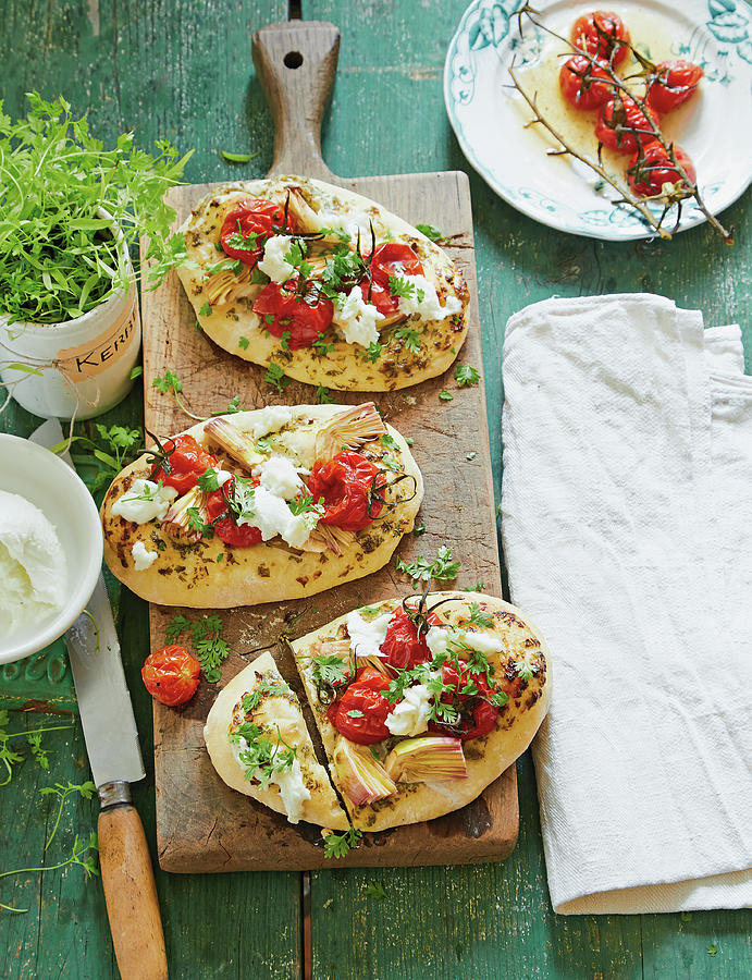 Pizza Pitas With Tomatoes, Artichokes, Mozzarella And Chervil Photograph by Jalag / Julia Hoersch