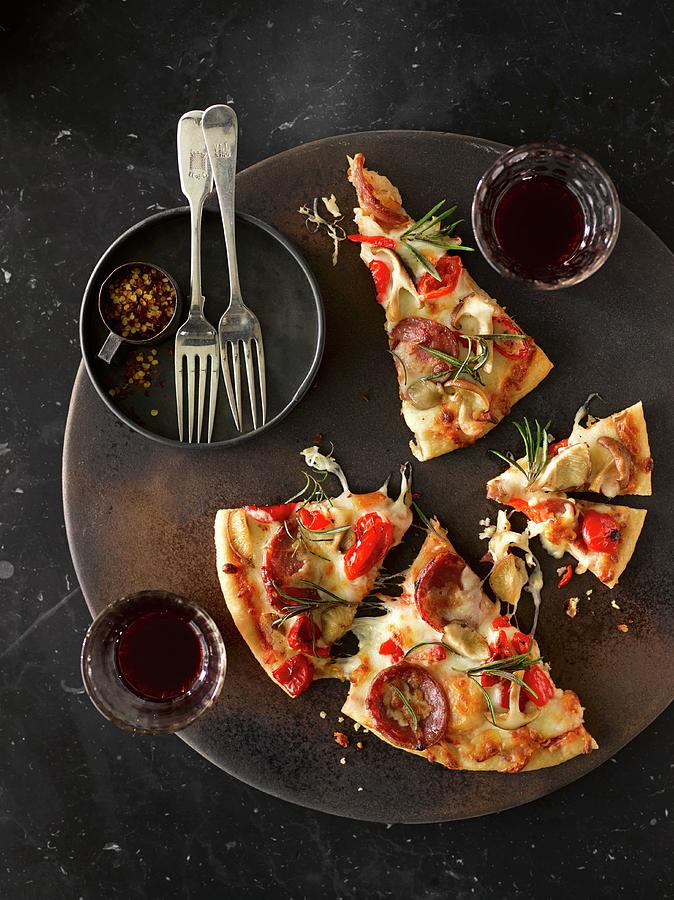 Pizza Slices With Peperoni, Mushroom And Pepper Served With Red Wine Photograph by Laurie Proffitt