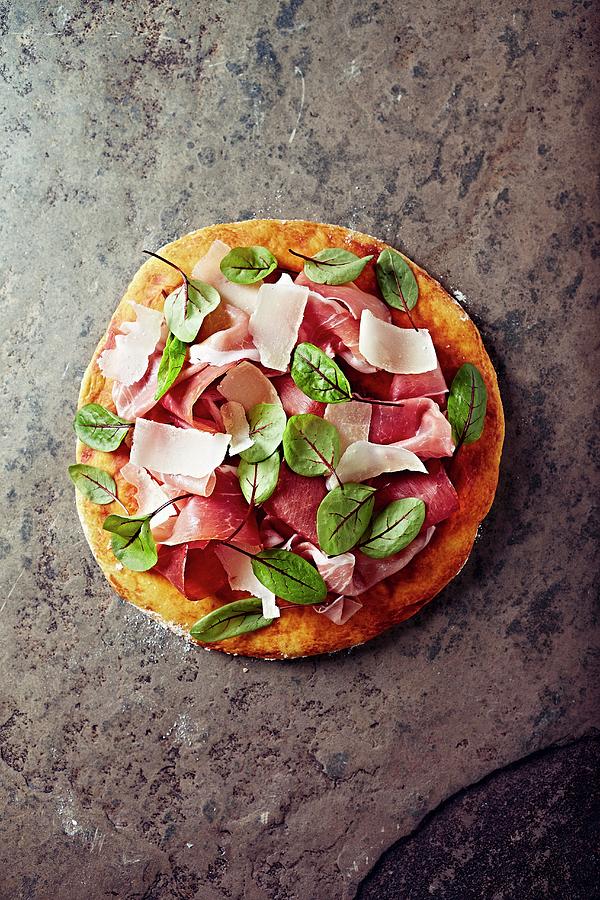 Pizza Topped With Cured Ham, Parmesan And Red Sorrel Photograph by B.&.e.dudzinski