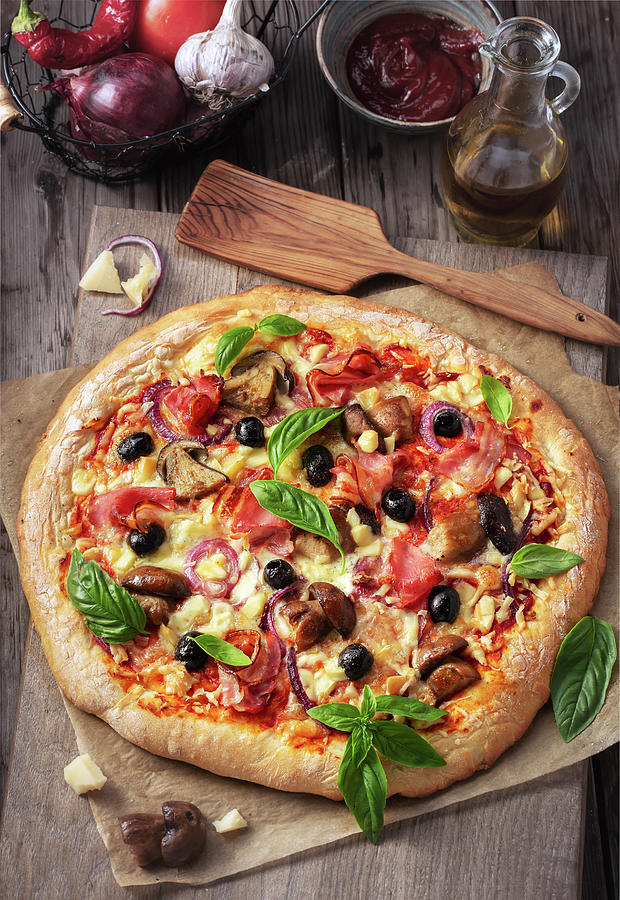 Pizza Veronese With Tomatoes, Mozzarella, Mushrooms And Prosciutto Photograph by Andrey Maslakov