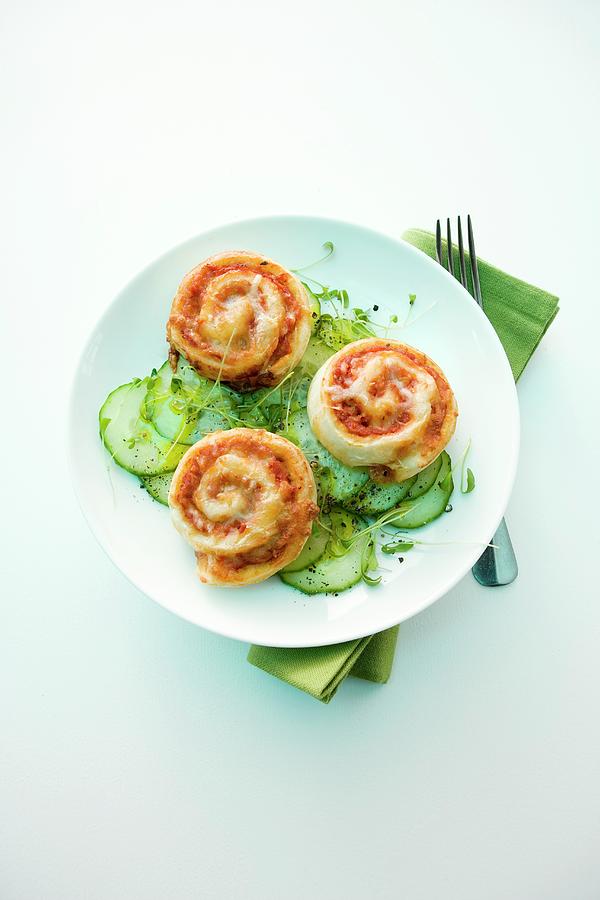 Pizza Whirls On A Cucumber Salad Photograph by Michael Wissing