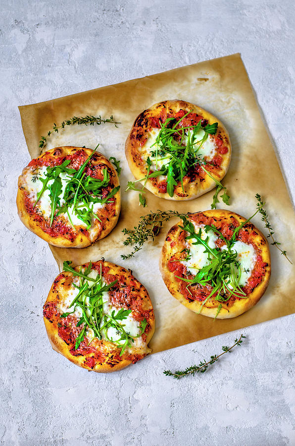 Pizza With Arugula On A Concrete Background Photograph by Gorobina
