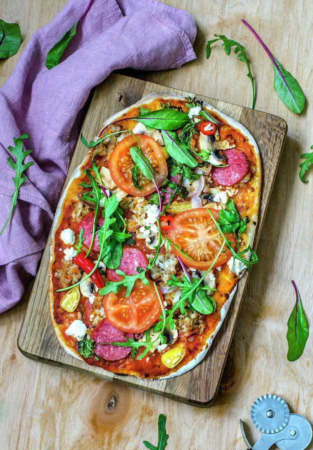 Pizza With Salami, Mushrooms, Feta, Tomatoes And Greens Photograph by Gorobina