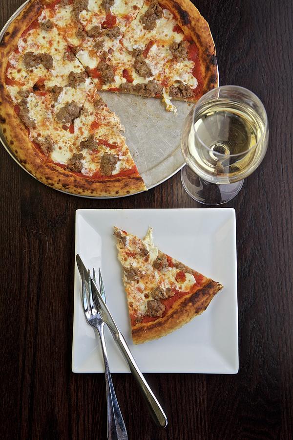 Pizza With Salsiccia Served With White Wine Photograph by Andre Baranowski