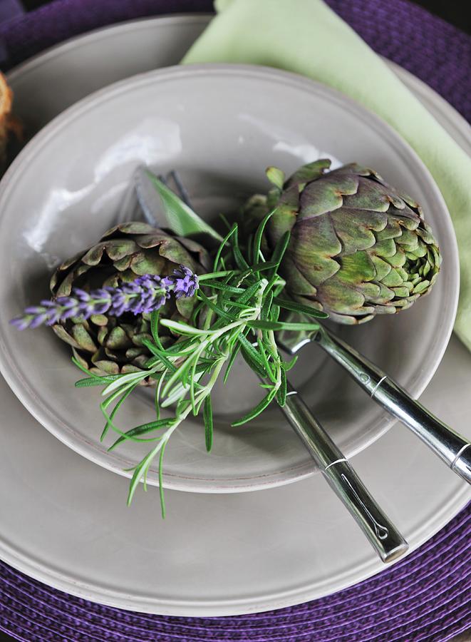 Place Setting Decorated With Artichokes & Sprig Of Rosemary Photograph by Twins